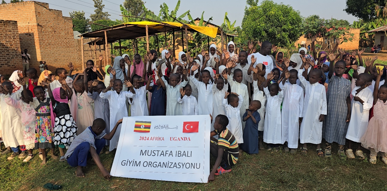 Community gathering during a Dost Aid Global clothing distribution in Uganda